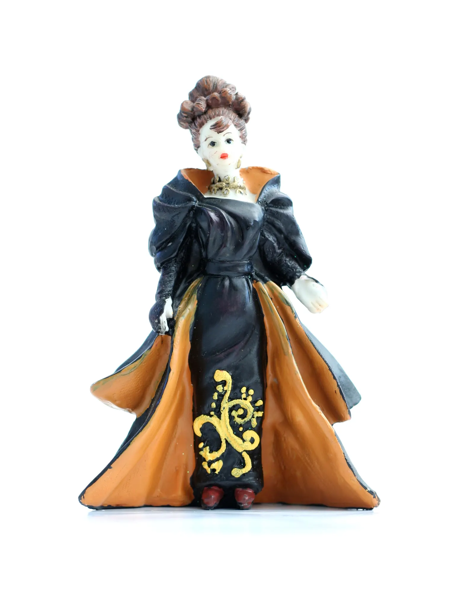 Figurine of a woman in a black and orange gown with gold pattern on white background