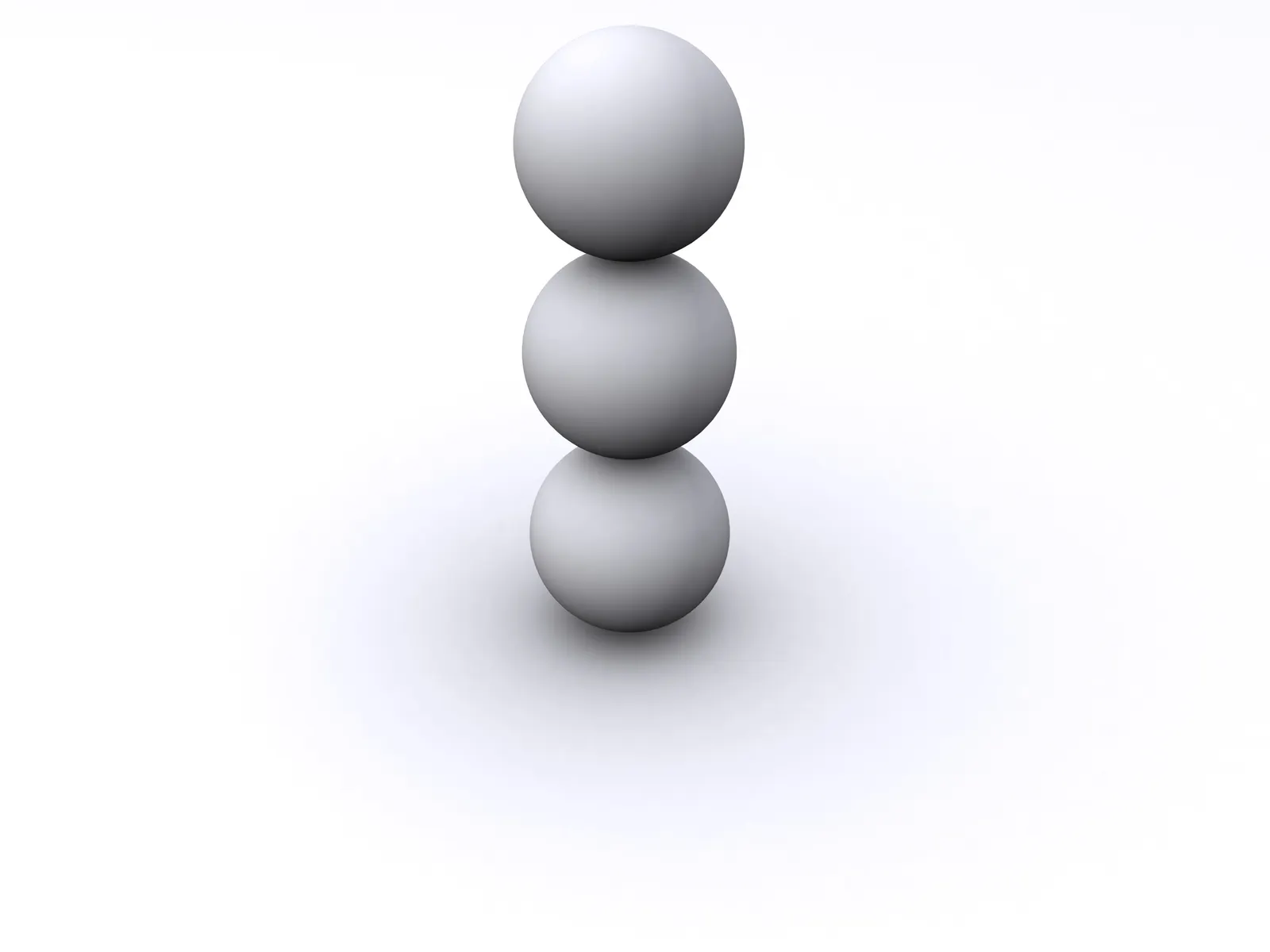 Three white spheres stacked on top of each other on a white background