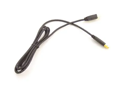 Black USB cable with gold connectors coiled on a white surface