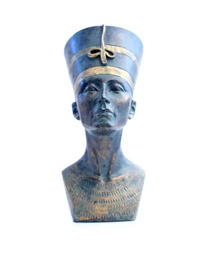 Bronze and gold bust of an ancient Egyptian queen wearing a tall crown on a white background