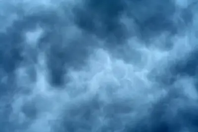 Dark blue storm clouds with soft billowing texture filling the frame